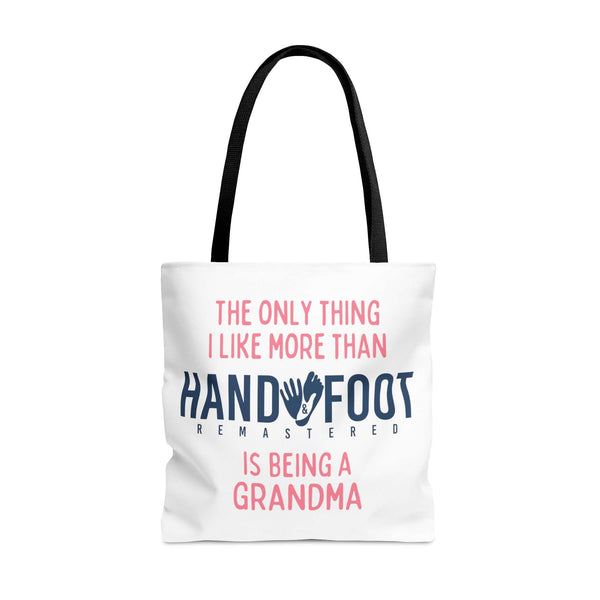 Polyester tote bag with 'Being a Grandma' and 'Hand & Foot Remastered' design, featuring black handles and durable build.