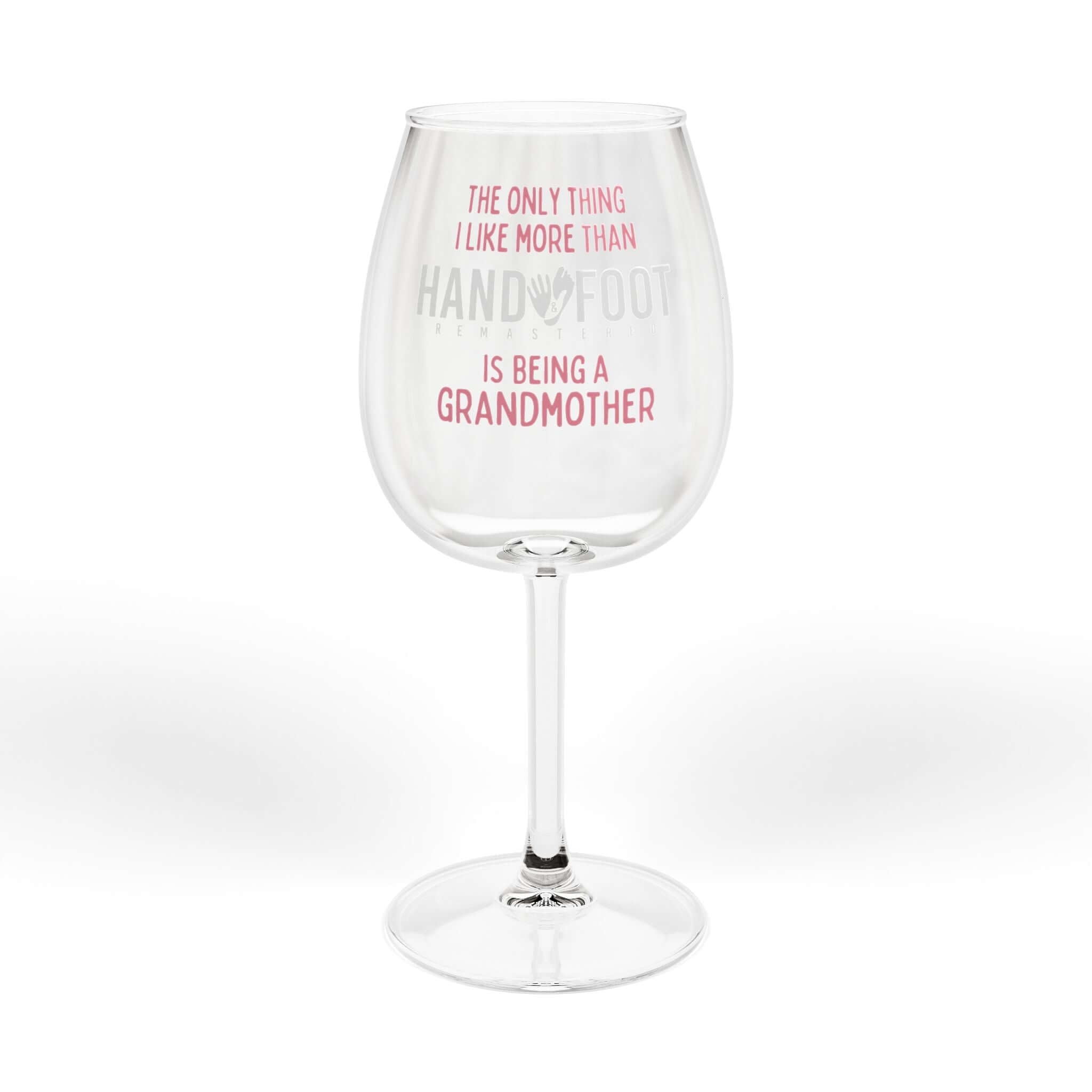 Being a Grandmother Hand & Foot wine glass with pink text, 12 oz capacity, elegant and glossy finish for game nights and wine lovers.