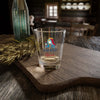 Hand & Foot Queen Shot Glass on wooden table in cozy setting, perfect for parties and celebrations.