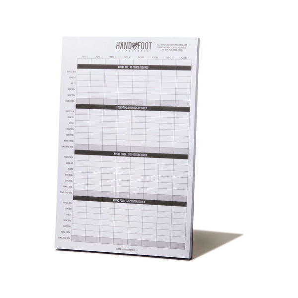 Score sheet from Hand & Foot Remastered Winter Gift Set, perfect for 2-8 players, shown standing upright on a white background.